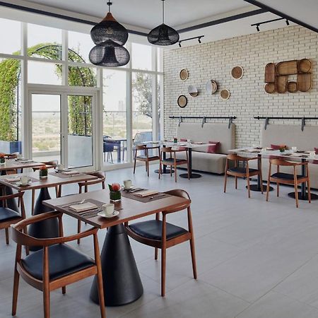 Movenpick Jumeirah Village Triangle Dubai Luaran gambar Restaurant