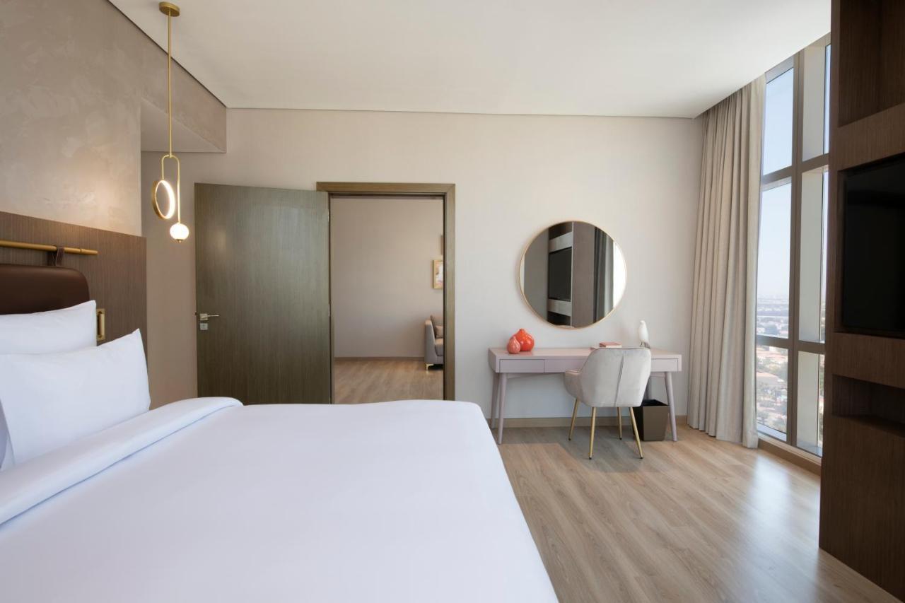 Movenpick Jumeirah Village Triangle Dubai Luaran gambar A bedroom at the hotel