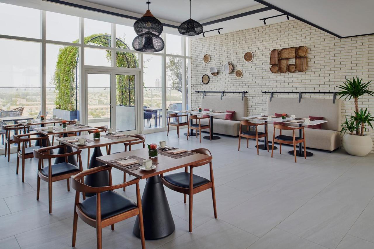 Movenpick Jumeirah Village Triangle Dubai Luaran gambar Restaurant