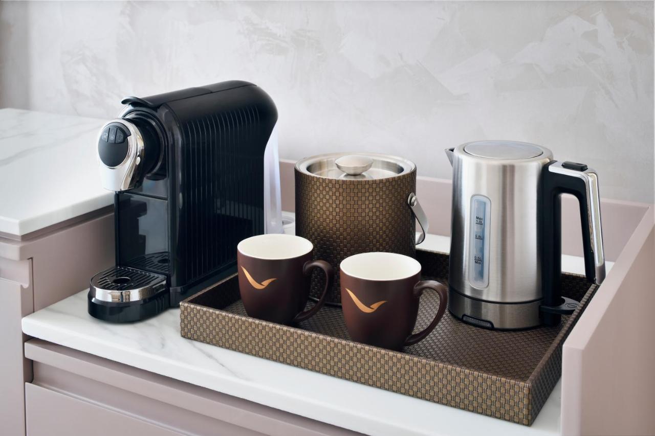 Movenpick Jumeirah Village Triangle Dubai Luaran gambar A Nespresso coffee machine